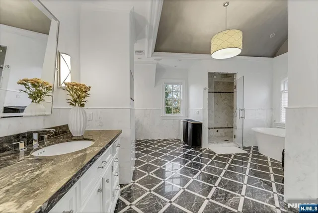 a swimming pool with outdoor seating and lake