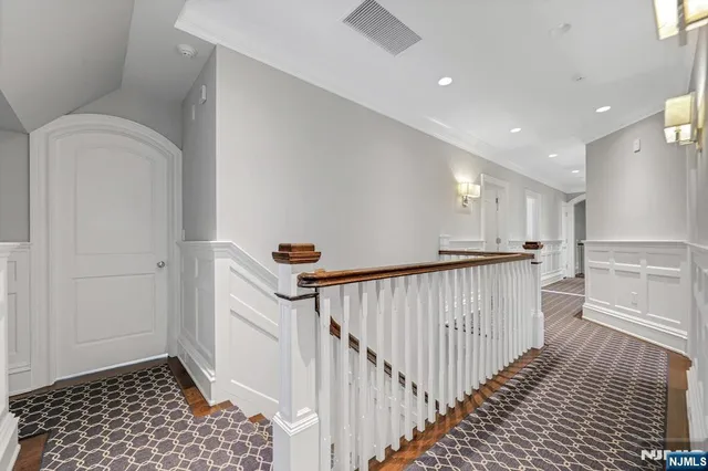 a bathroom with a granite countertop sink a mirror and a shower