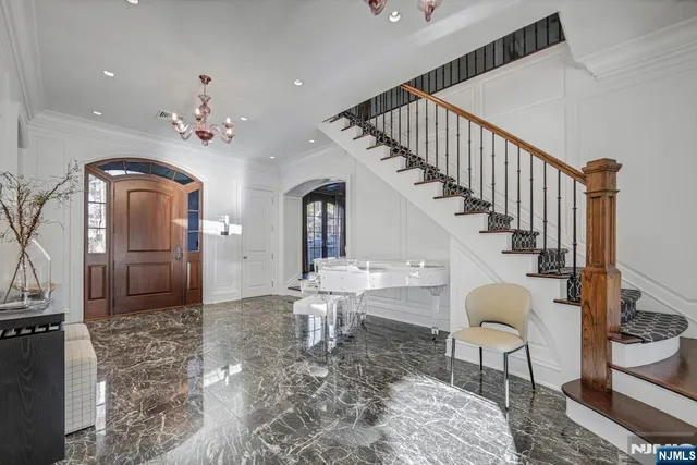 a living room with fireplace furniture and a flat screen tv