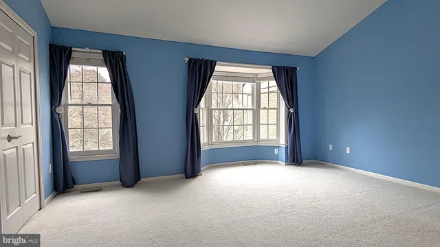 an empty room with windows