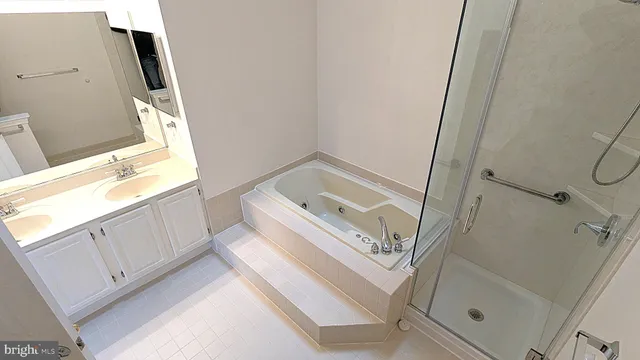 a bathroom with a sink a window and a mirror