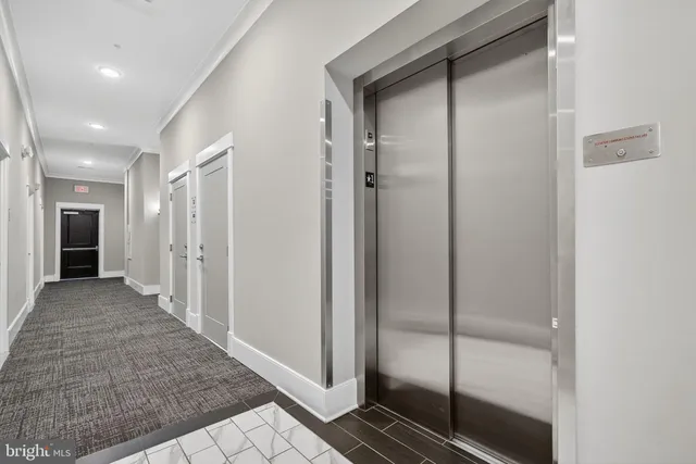 a view of a hallway with closet