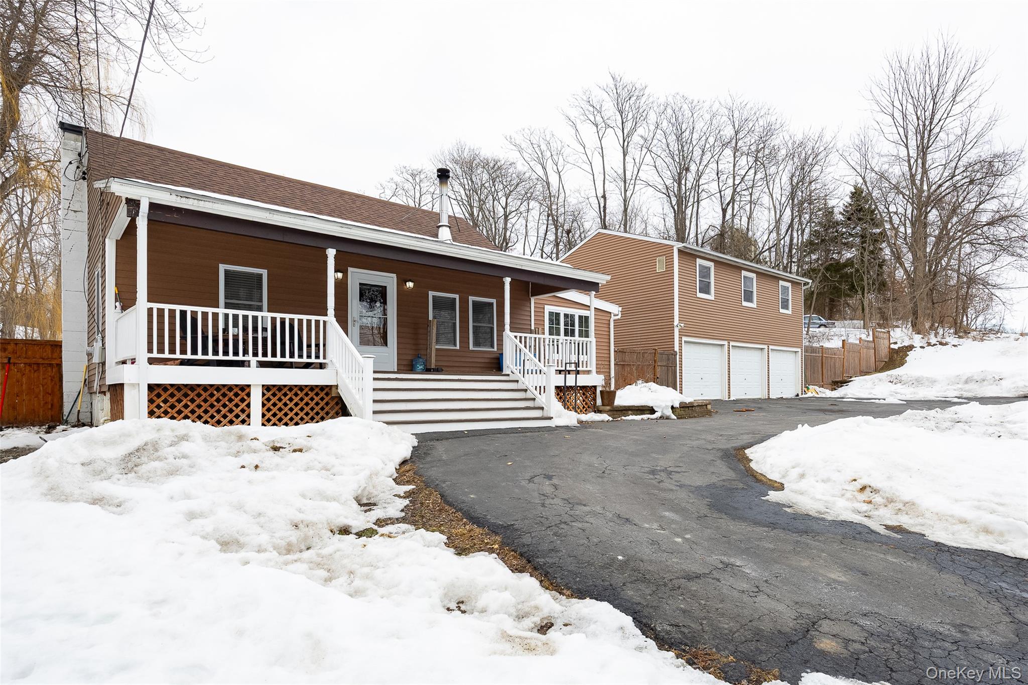 95 Chelsea Road Wappingers Falls, NY 12590 - Photo 1 of 1 a side view of a house with a yard covered in snow