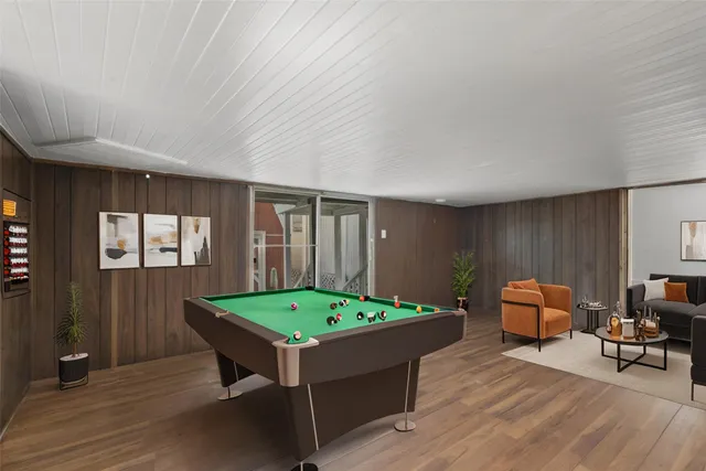 a room with furniture and air hockey table