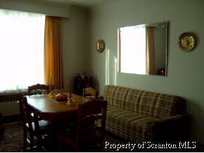 941 Hemlock Street Scranton, PA 18505 - Photo 2 of 4 a view of a dining room with furniture and a window