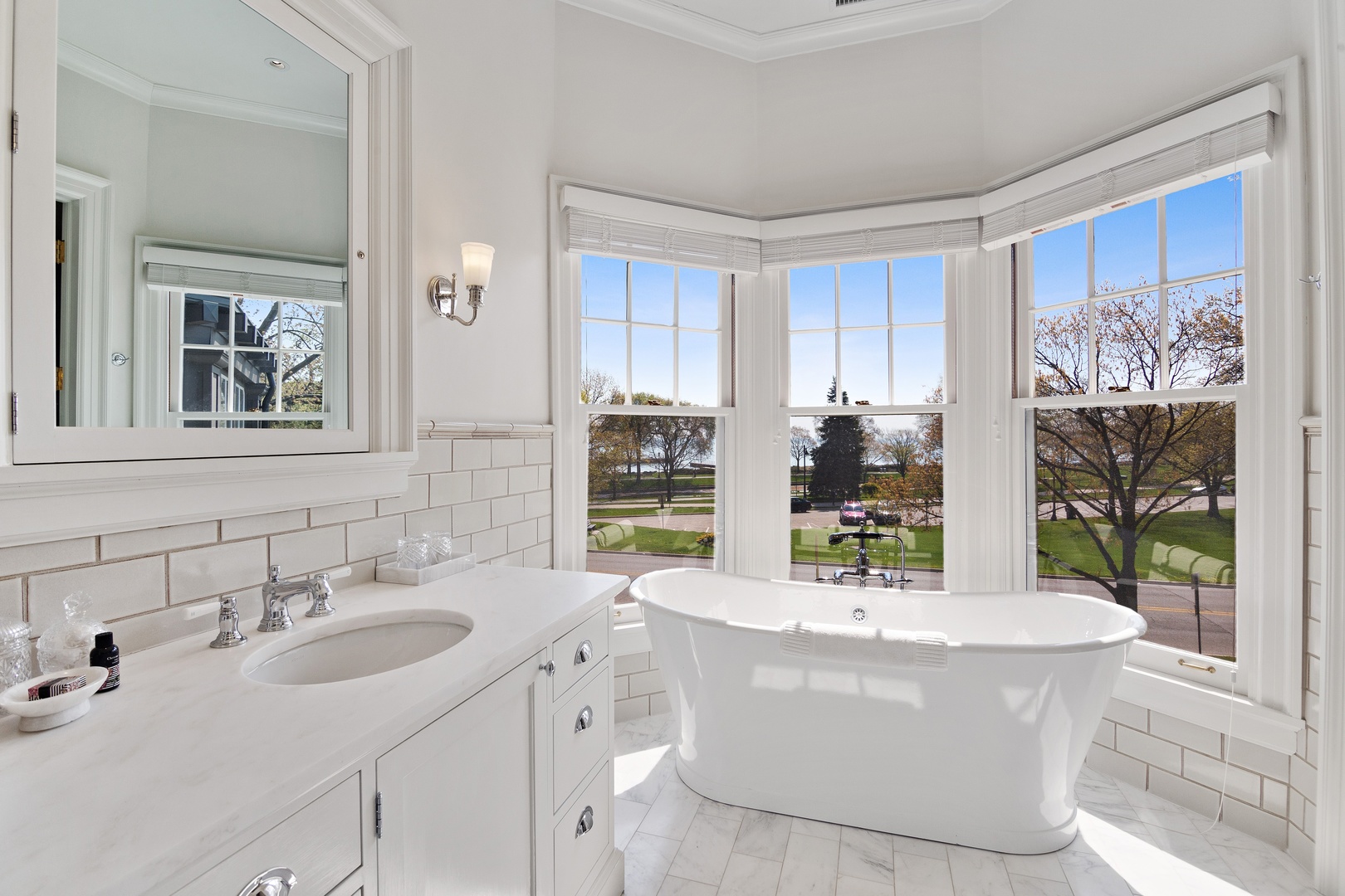 1622 Forest Place Evanston, IL 60201 - Photo 22 of 47 a room with kitchen island stainless steel appliances a sink a counter top space and a window