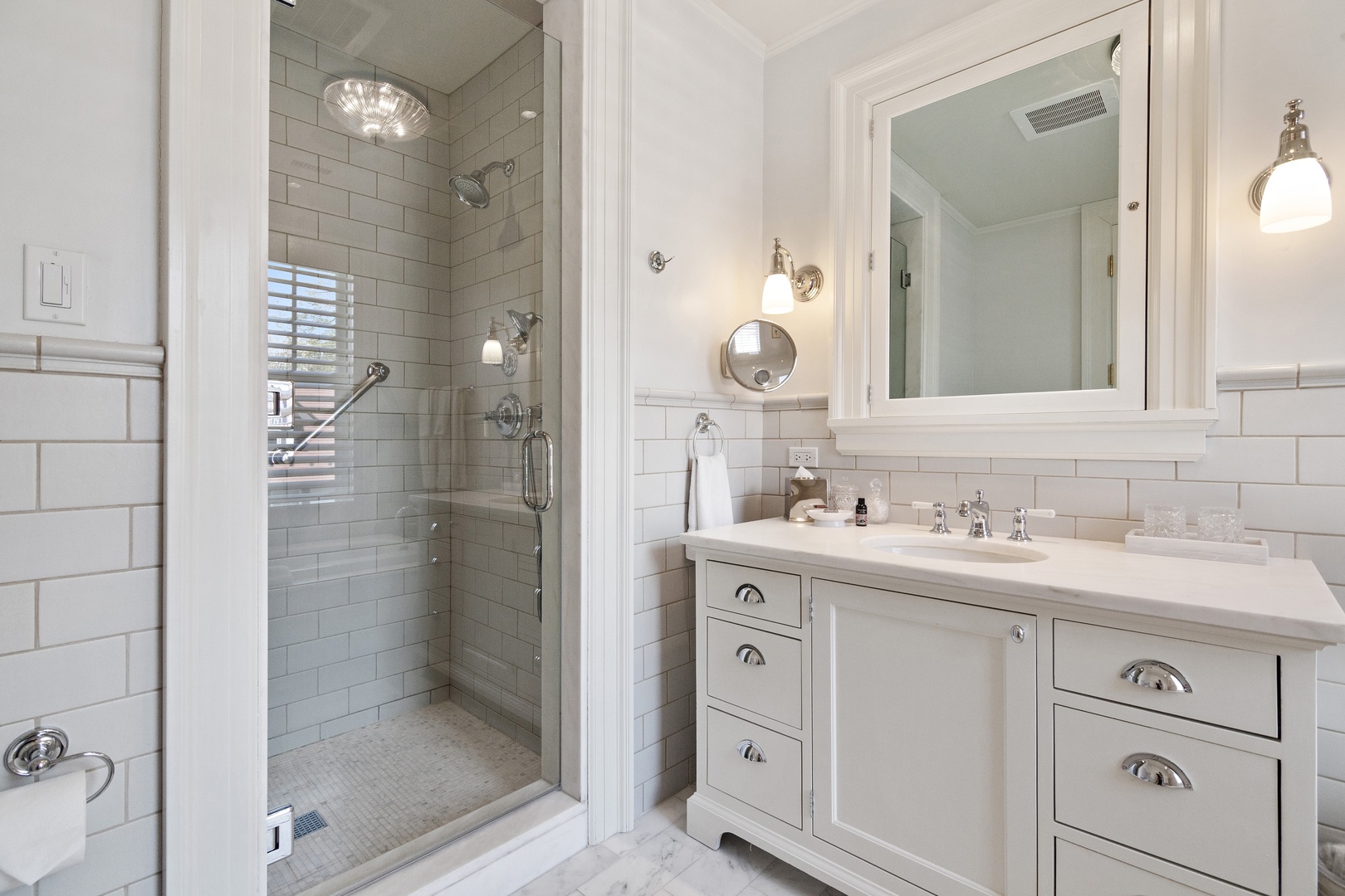 1622 Forest Place Evanston, IL 60201 - Photo 31 of 47 a bathroom with a shower sink and mirror