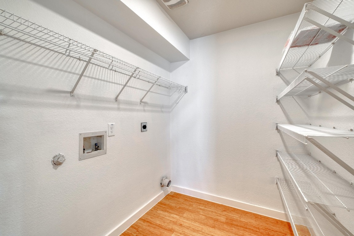 12825 James Madison Street Manor, TX 78653 - Photo 14 of 24 a view of a room with racks on the wall