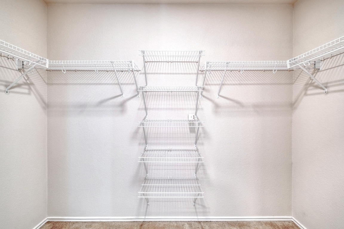 12825 James Madison Street Manor, TX 78653 - Photo 18 of 24 a view of a walk in closet