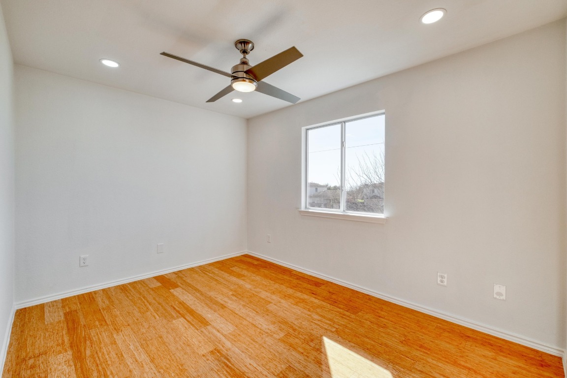 12825 James Madison Street Manor, TX 78653 - Photo 20 of 24 an empty room with a window and a ceiling fan