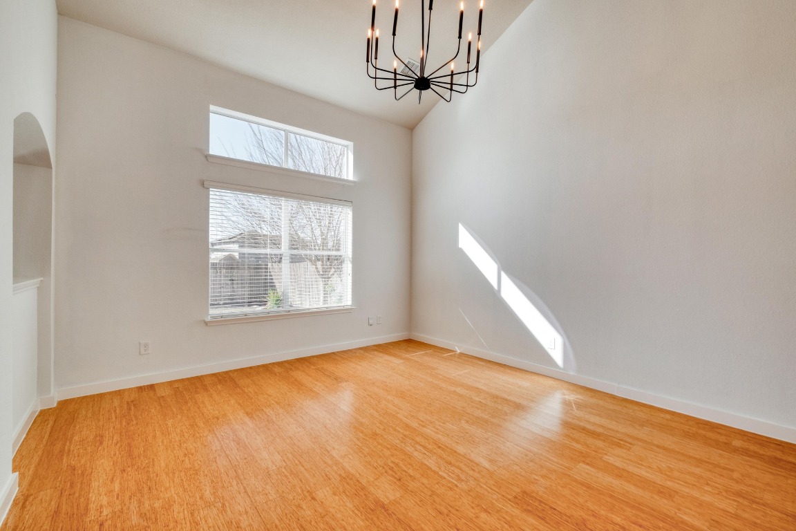 12825 James Madison Street Manor, TX 78653 - Photo 6 of 24 a view of empty room with wooden floor and fan