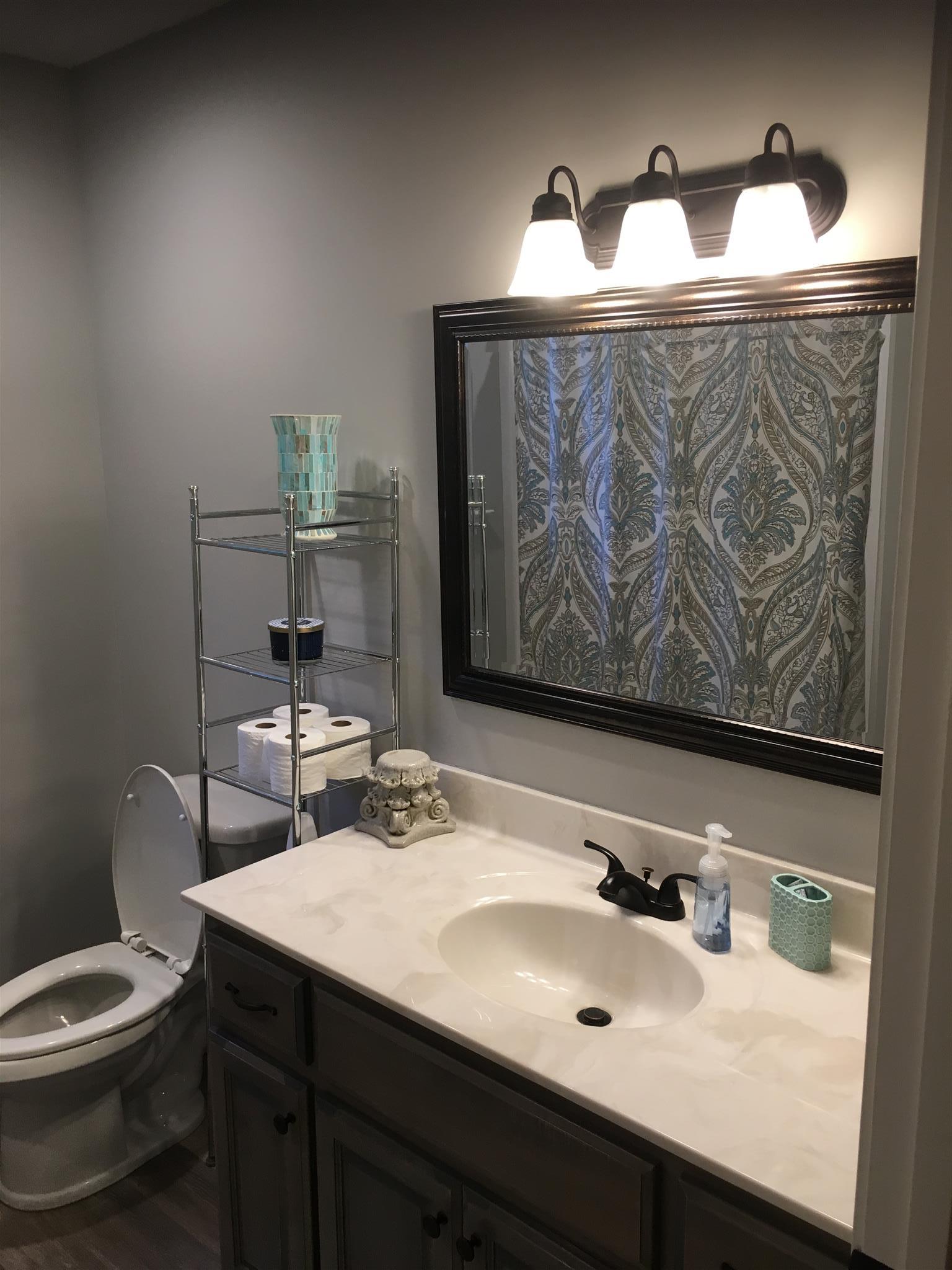 121 Point Road Portland, TN 37148 - Photo 20 of 23 a bathroom with a sink and a mirror