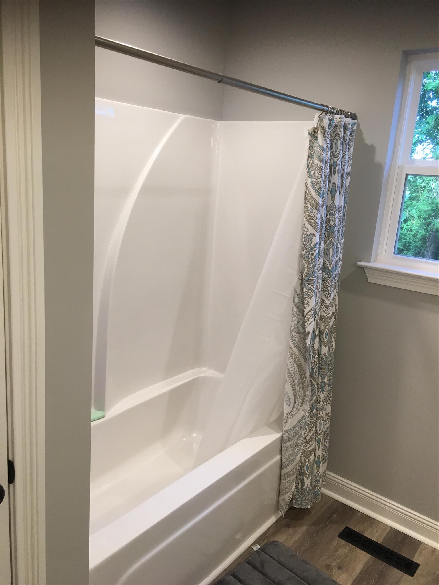 121 Point Road Portland, TN 37148 - Photo 21 of 23 a bathroom with a shower curtain and a window