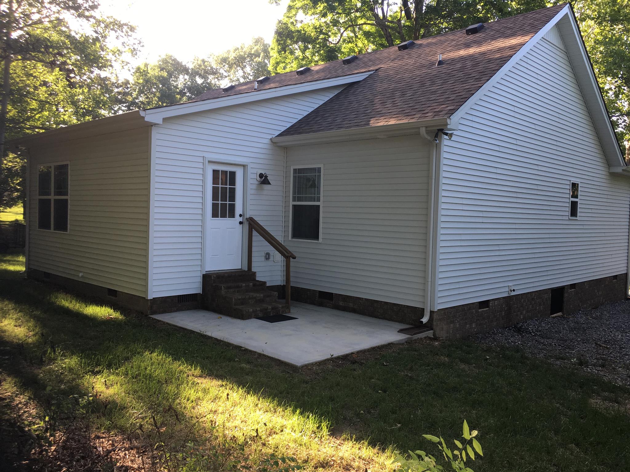 121 Point Road Portland, TN 37148 - Photo 3 of 23 a view of a small house with a yard