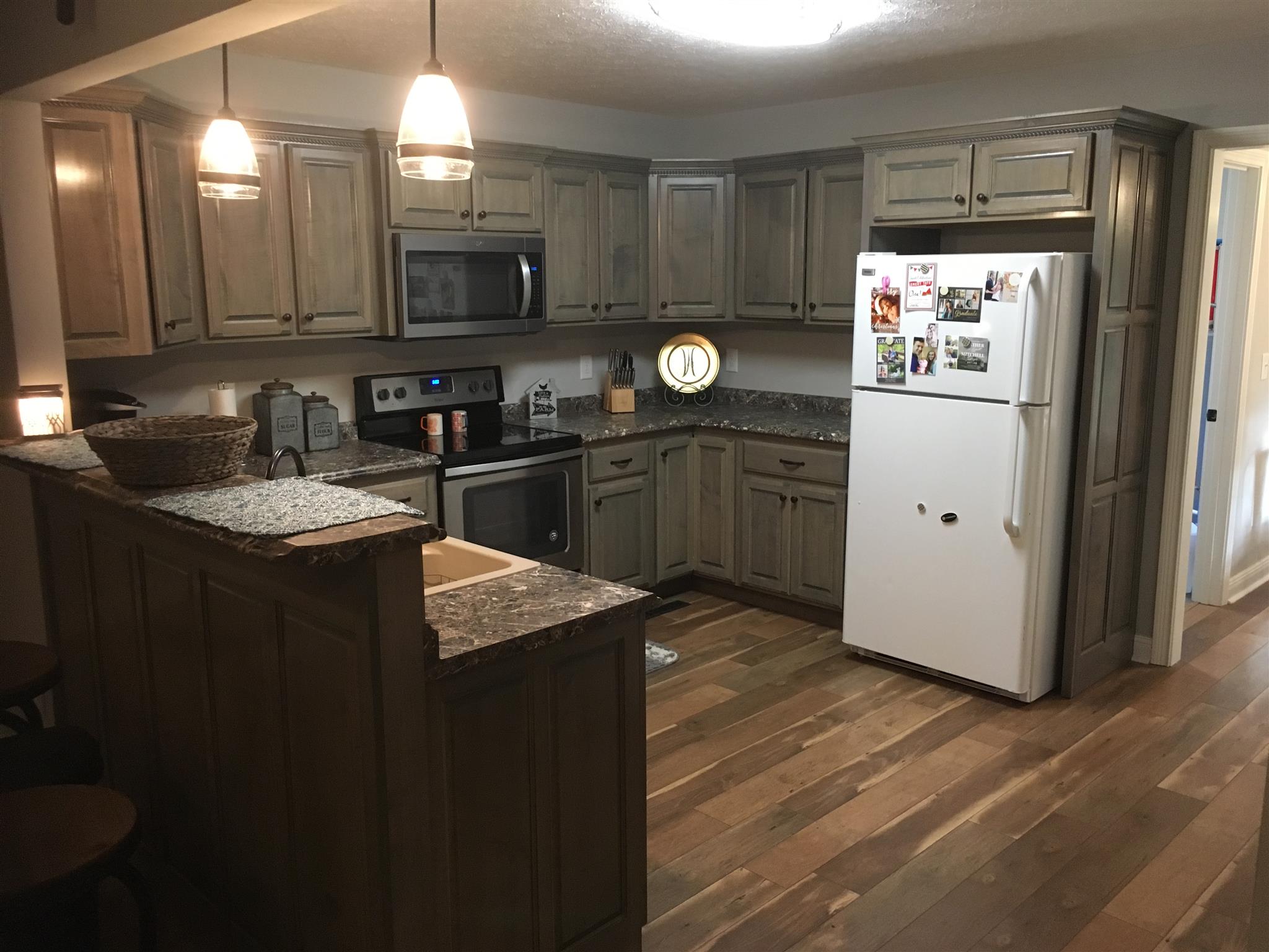 121 Point Road Portland, TN 37148 - Photo 8 of 23 a kitchen with a sink appliances and cabinets