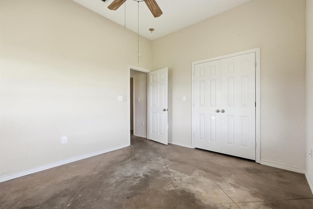 12190 Bell Road Pilot Point, TX 76258 - Photo 28 of 39 Spacious room featuring a vaulted ceiling and a wood-finish ceiling fan