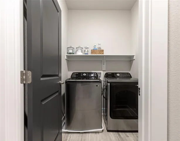 a utility room with washer and dryer