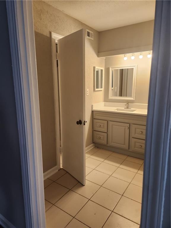 94 Rue Fontaine Lithonia, GA 30038 - Photo 12 of 13 a view of a kitchen with white cabinets