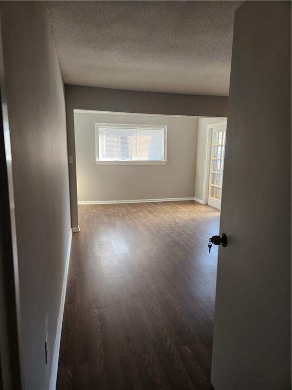94 Rue Fontaine Lithonia, GA 30038 - Photo 4 of 13 an empty room with wooden floor and windows