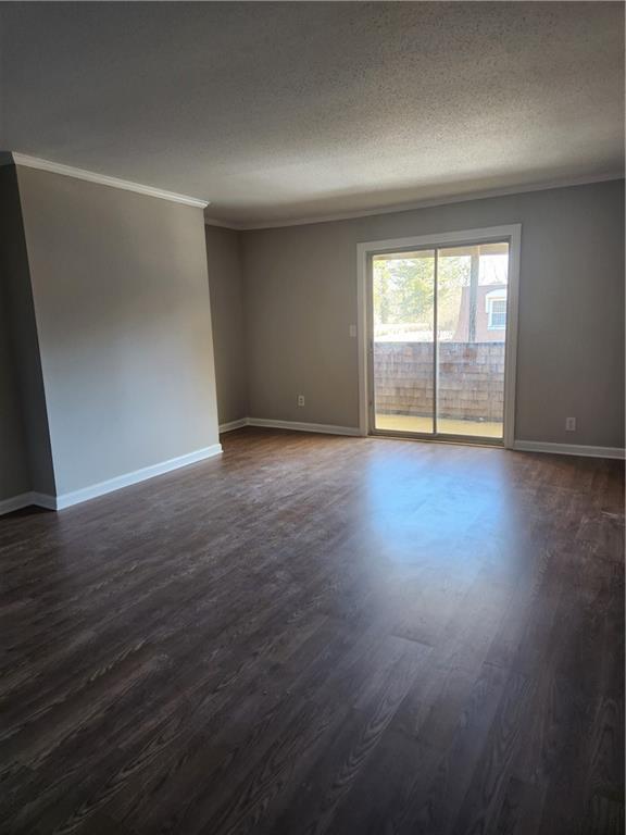 94 Rue Fontaine Lithonia, GA 30038 - Photo 5 of 13 an empty room with wooden floor and windows