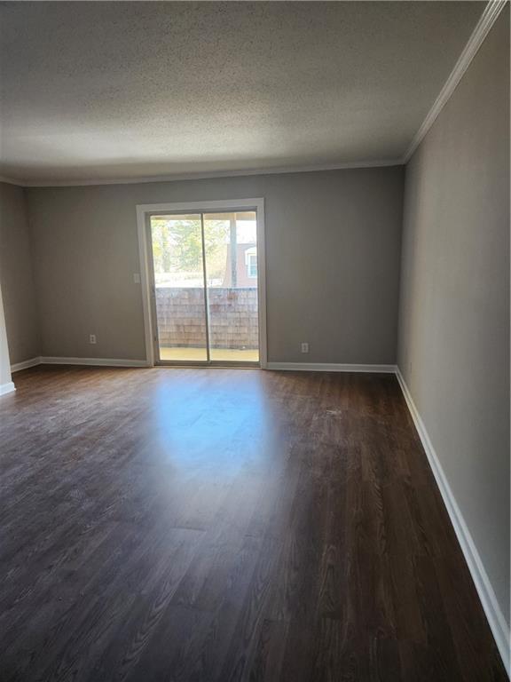 94 Rue Fontaine Lithonia, GA 30038 - Photo 6 of 13 a view of an empty room with wooden floor and a window