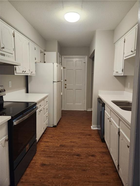 94 Rue Fontaine Lithonia, GA 30038 - Photo 7 of 13 a kitchen with stainless steel appliances a stove refrigerator sink and cabinets