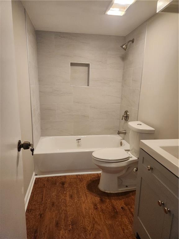 94 Rue Fontaine Lithonia, GA 30038 - Photo 9 of 13 a bathroom with a toilet a sink and bathtub