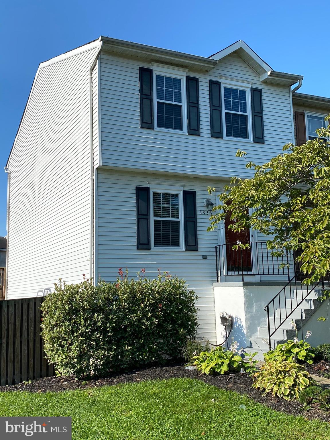 3933 Cutty Sark Road Baltimore, MD 21220 - Photo 2 of 69 a front view of a house with a yard and potted plants