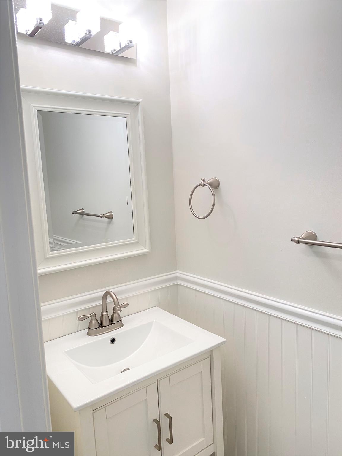 3933 Cutty Sark Road Baltimore, MD 21220 - Photo 22 of 69 a bathroom with a sink vanity and a mirror