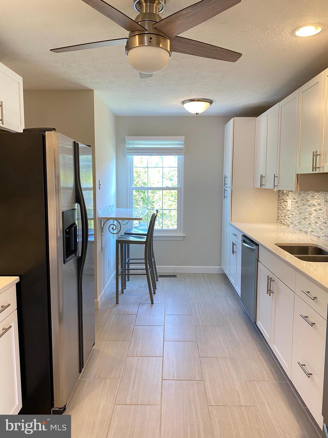 3933 Cutty Sark Road Baltimore, MD 21220 - Photo 28 of 69 a kitchen with stainless steel appliances granite countertop a refrigerator and a sink