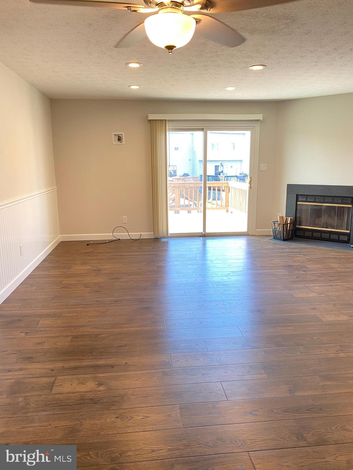 3933 Cutty Sark Road Baltimore, MD 21220 - Photo 36 of 69 an empty room with wooden floor and outdoor view