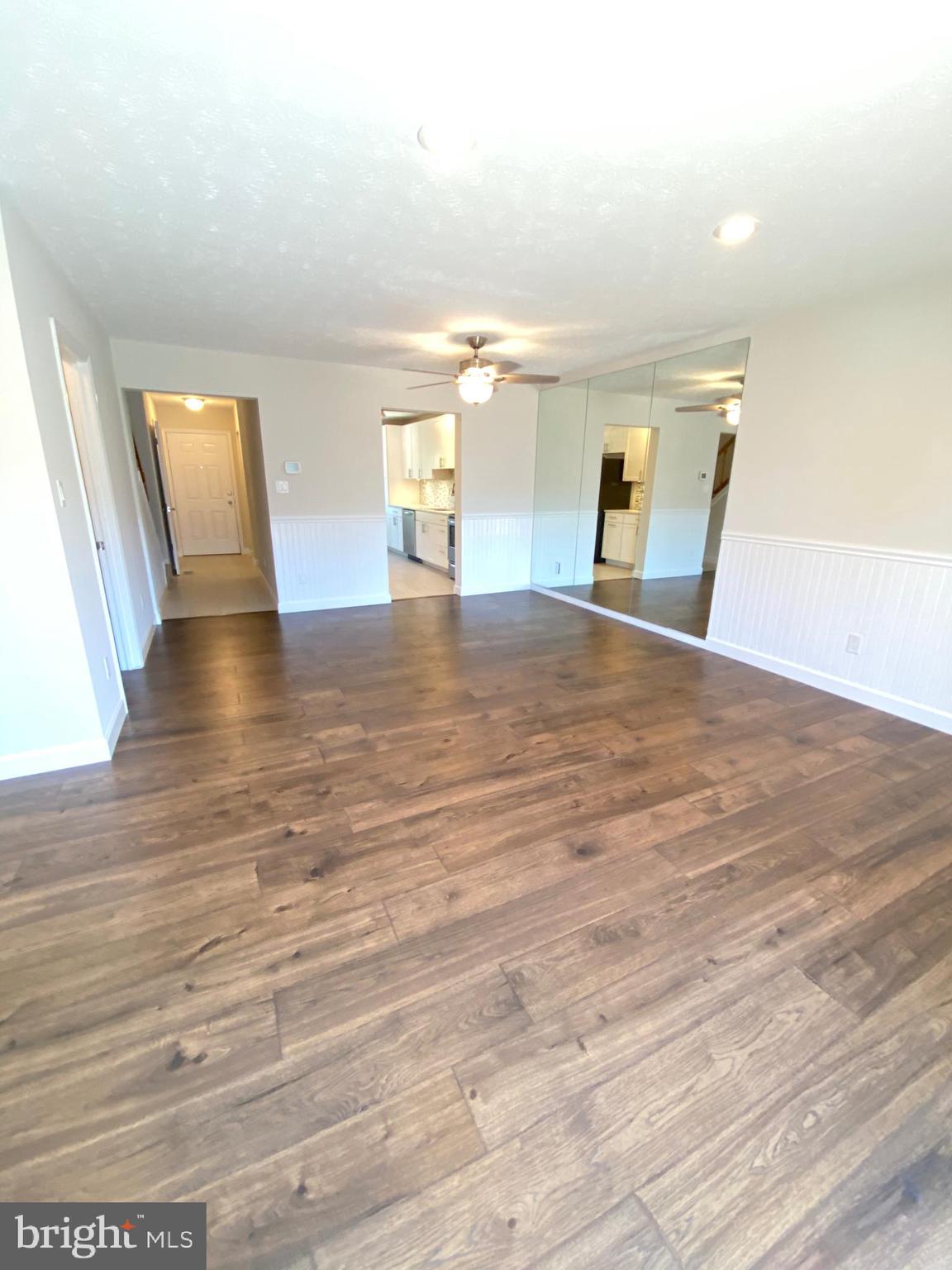 3933 Cutty Sark Road Baltimore, MD 21220 - Photo 39 of 69 an empty room with wooden floor and windows
