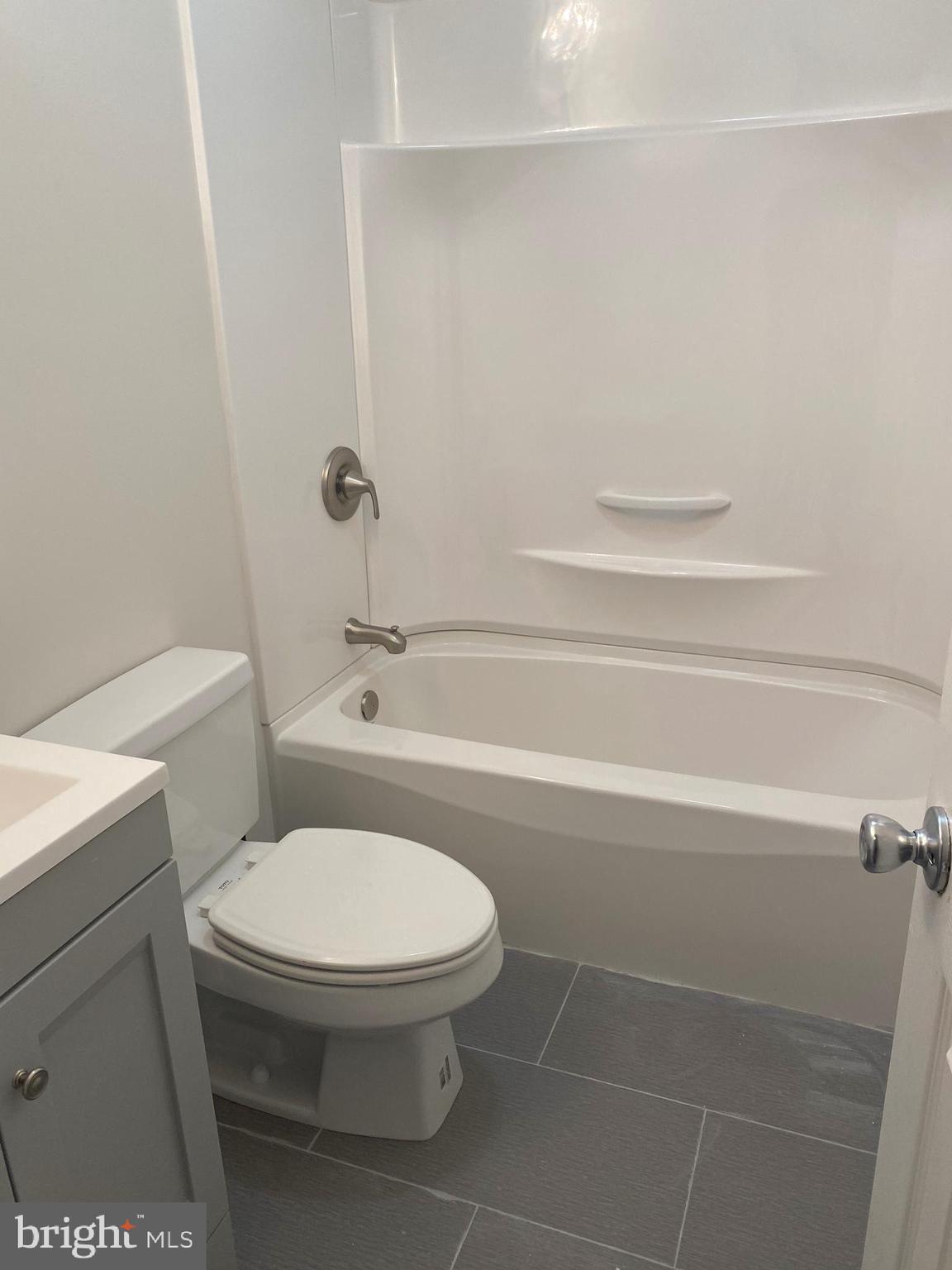 3933 Cutty Sark Road Baltimore, MD 21220 - Photo 56 of 69 a bathroom with a toilet and a shower
