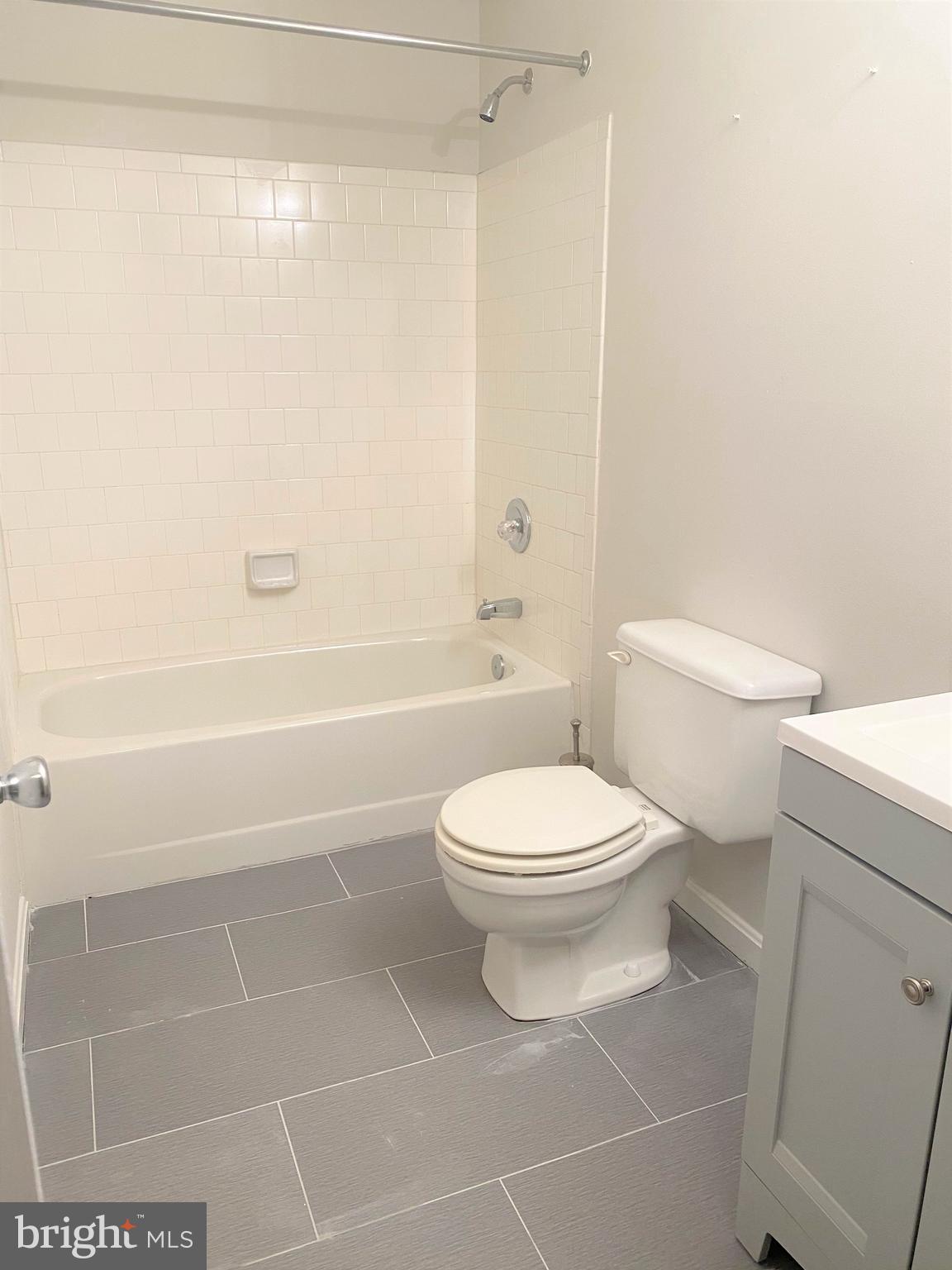 3933 Cutty Sark Road Baltimore, MD 21220 - Photo 62 of 69 a bathroom with a toilet a sink and shower