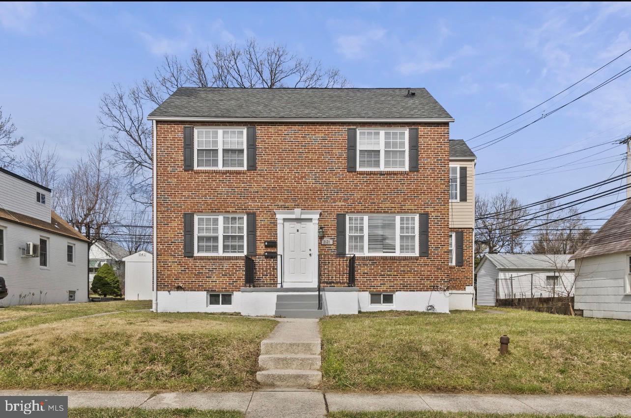 Charming brick duplex with inviting curb appeal.