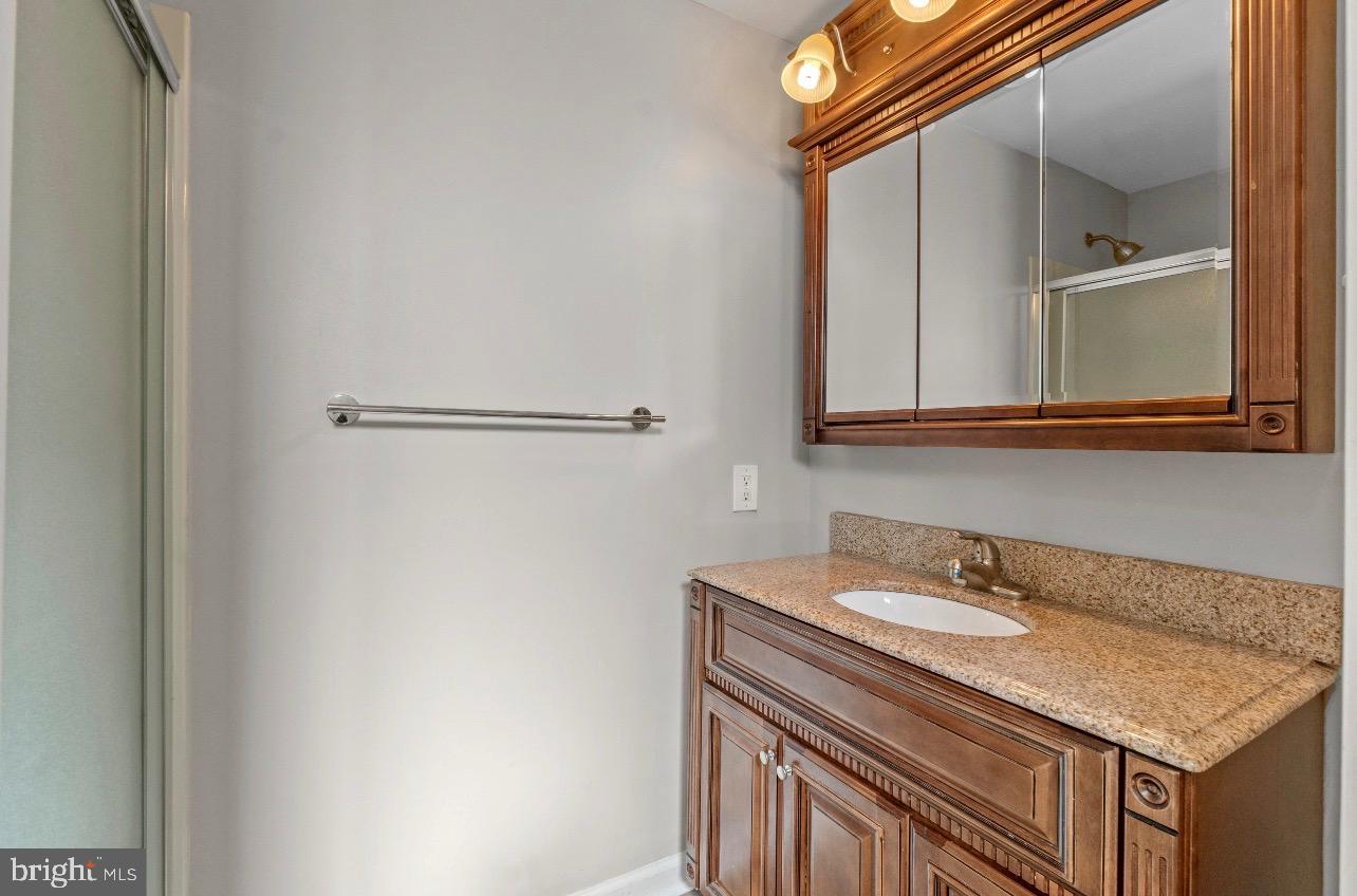 2528 Wendover Road, Unit A Baltimore, MD 21234 - Photo 17 of 18 Elegant bathroom with rich wood accents.