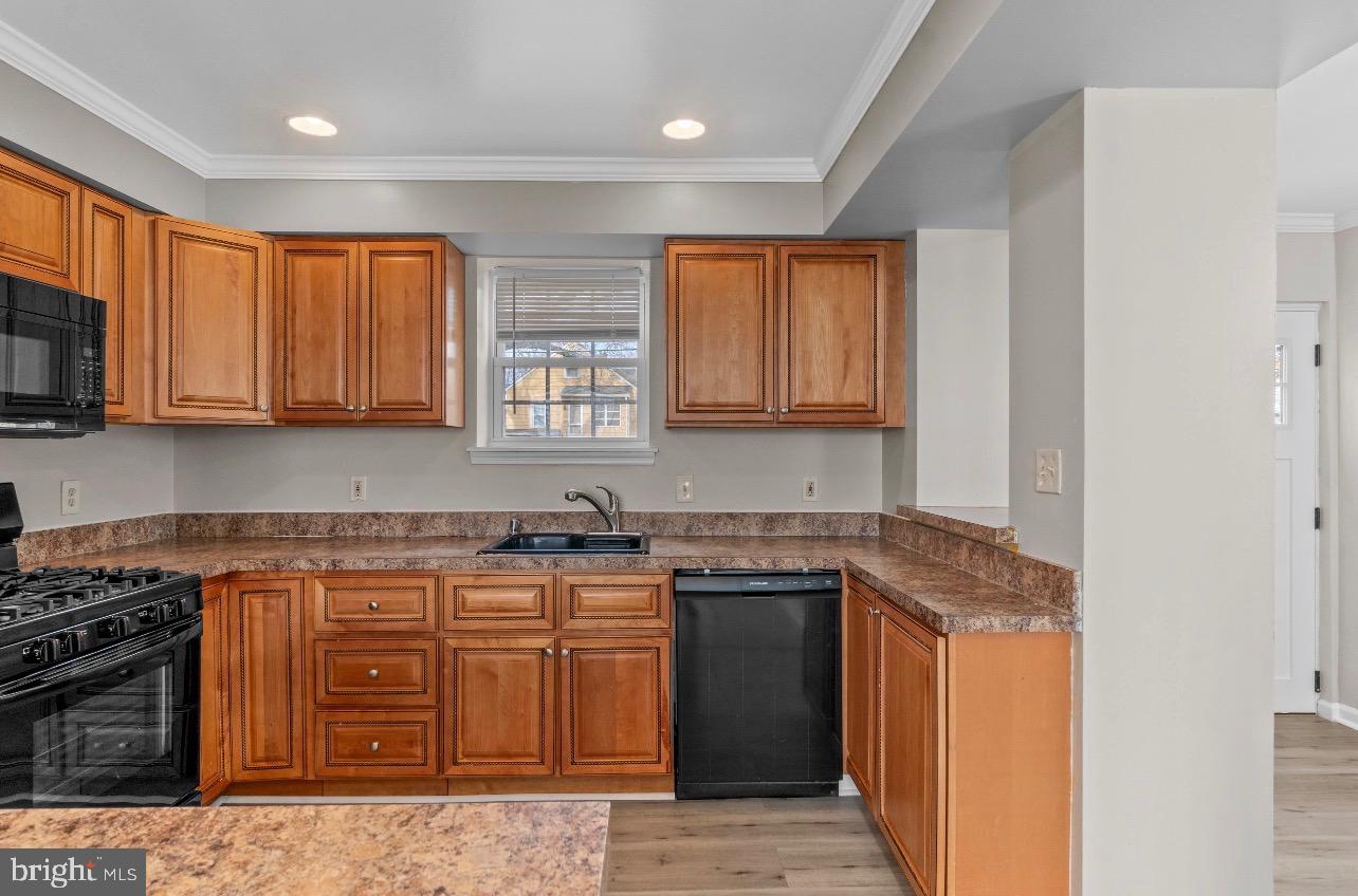 2528 Wendover Road, Unit A Baltimore, MD 21234 - Photo 8 of 18 Modern kitchen with warm wood cabinetry.