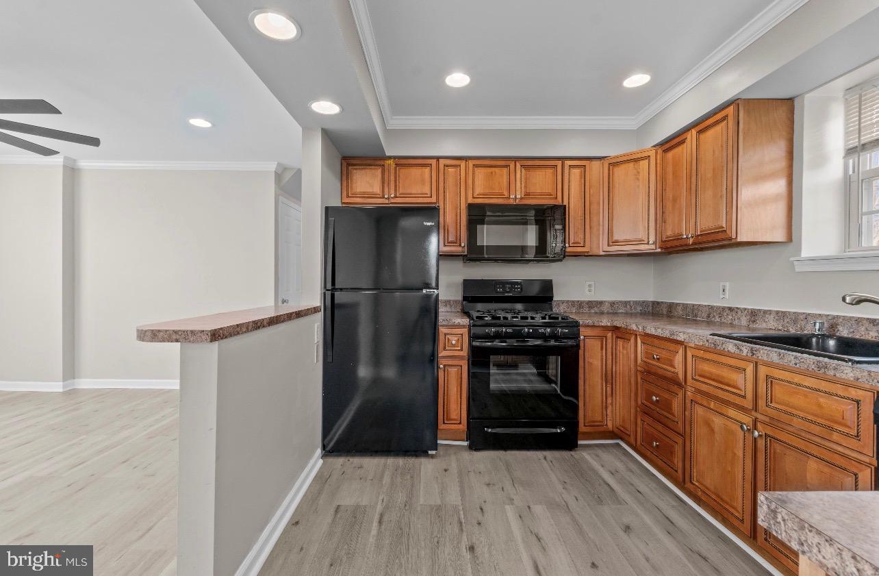 2528 Wendover Road, Unit A Baltimore, MD 21234 - Photo 10 of 18 Modern kitchen with warm wood accents.