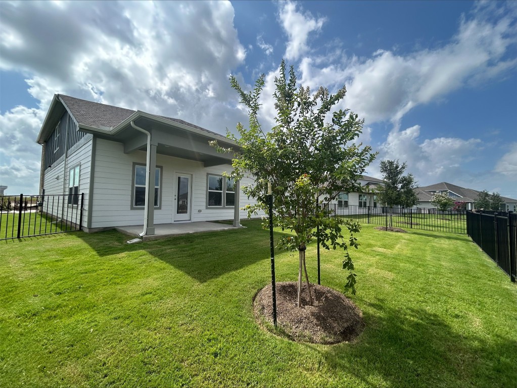 17112 Lomond Way Pflugerville, TX 78660 - Photo 9 of 9 Back of property featuring a patio and a fenced backyard