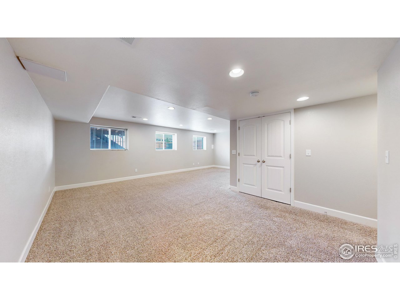 419 Clark Street Johnstown, CO 80534 - Photo 13 of 31 a open hall with wooden floor