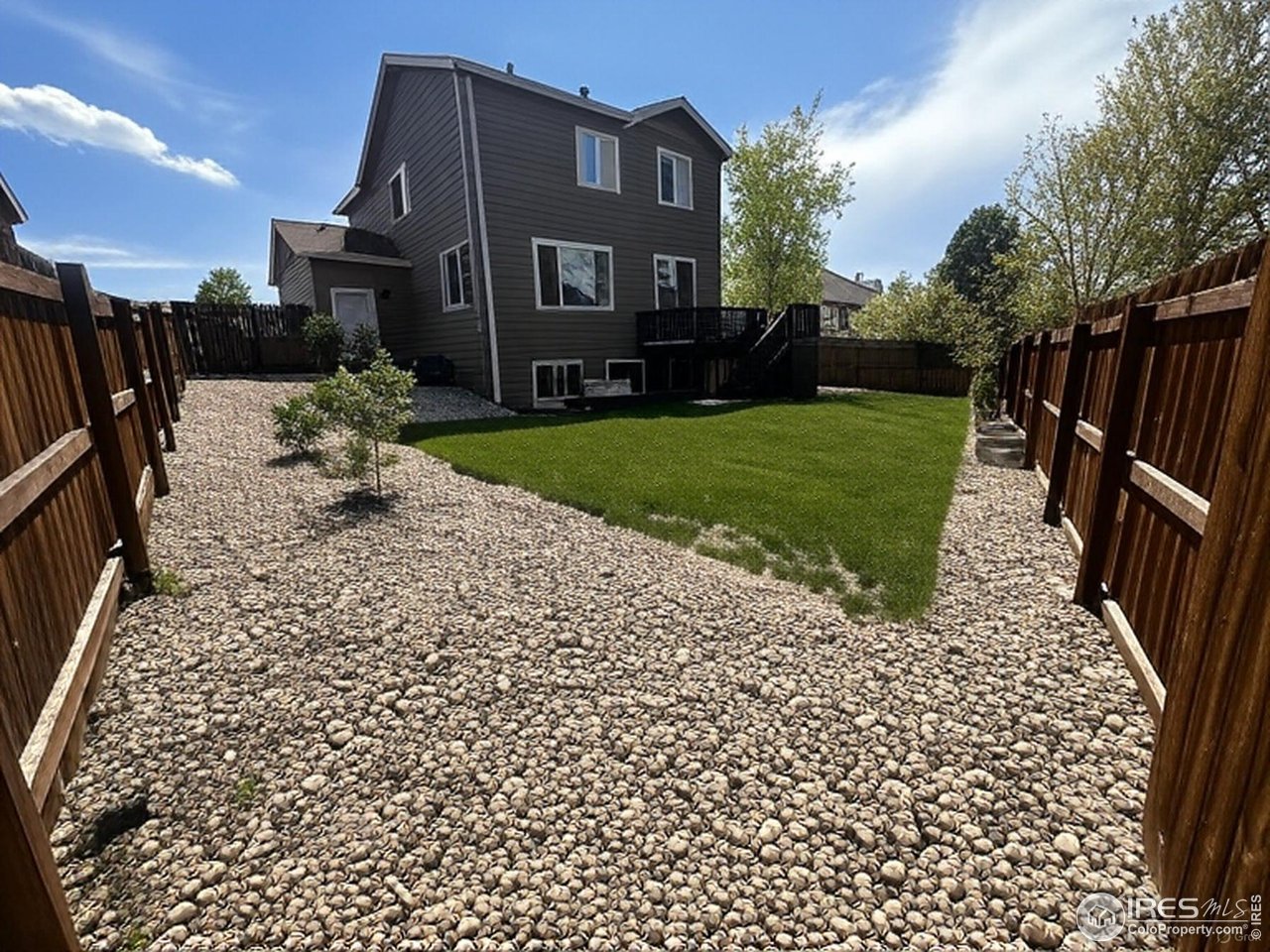 419 Clark Street Johnstown, CO 80534 - Photo 24 of 31 a front view of a house with a yard