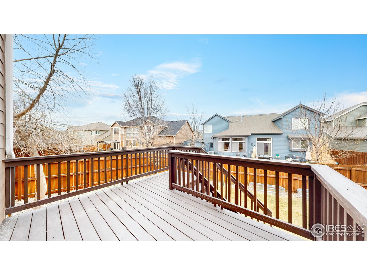 419 Clark Street Johnstown, CO 80534 - Photo 25 of 31 a view of a balcony with wooden floor