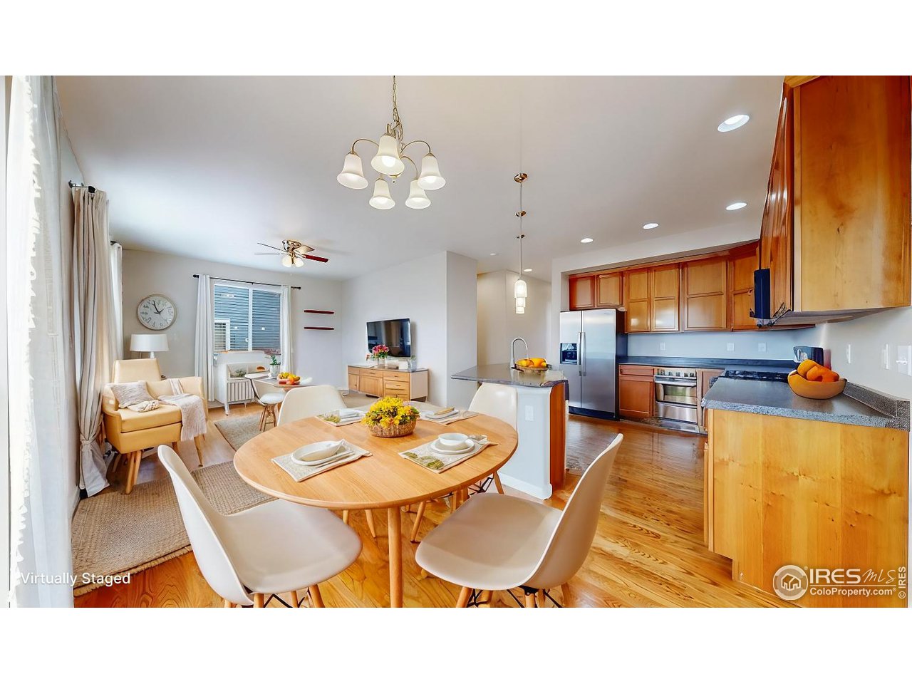 419 Clark Street Johnstown, CO 80534 - Photo 6 of 31 a view of a dining room with furniture