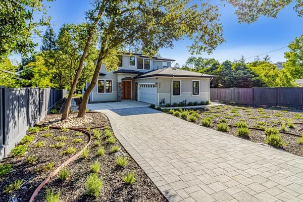 a swimming pool with outdoor seating and yard