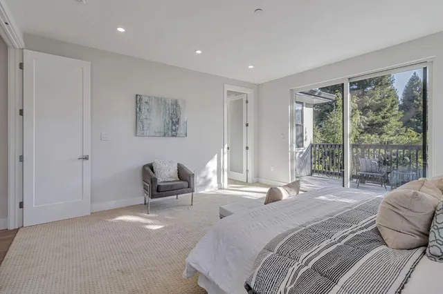 a view of a livingroom with furniture window and wooden floor