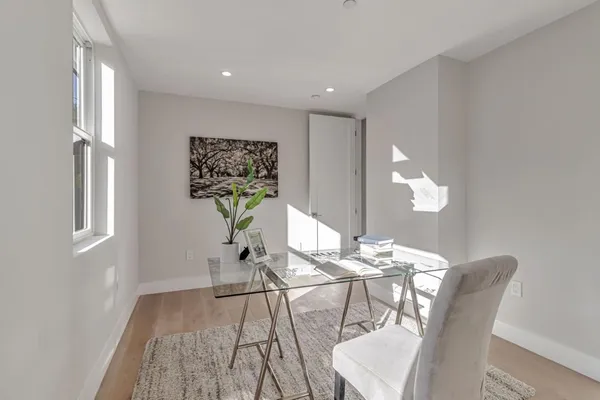 a kitchen with stainless steel appliances kitchen island granite countertop a stove and a sink