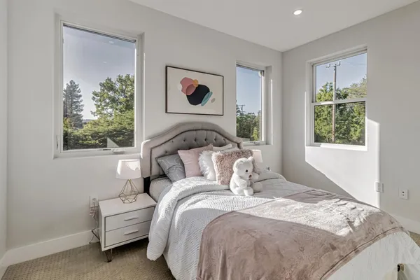 a view of a livingroom with furniture window and wooden floor