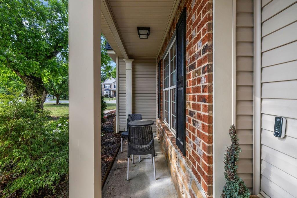 126 Meadow's Walk Drive Byron, GA 31008 - Photo 4 of 37 a balcony with table and chairs