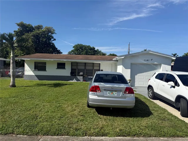 a car parked in front of a house