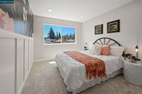 a view of a livingroom with furniture and a window